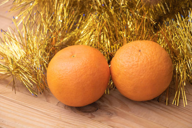 Orange fruits in a wooden basket to make orange juice in a restaurant at night.