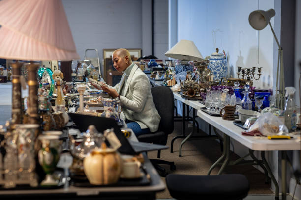 istock Auction House Professional Examines Antique Collection 2192980168