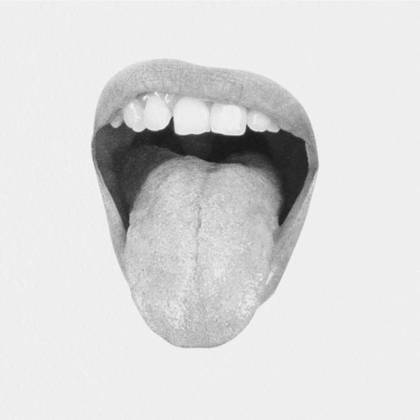 istock Woman lips with visible teeth showing tongue 2192981039