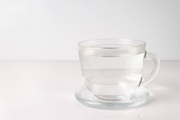 istock boiled water in a transparent glass cup on a white background, copy space 2192987805