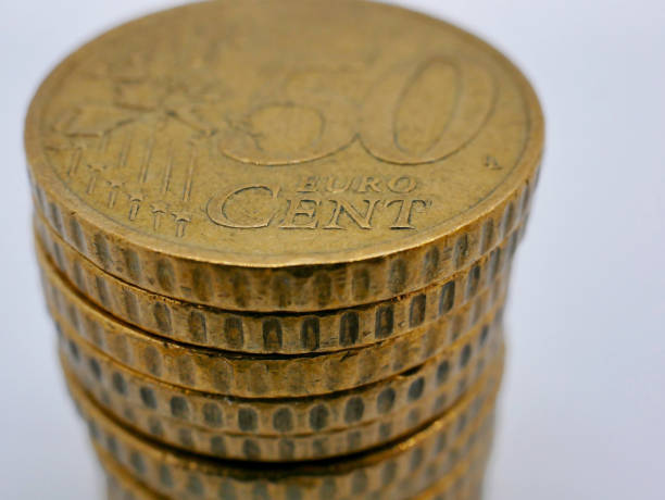 istock A stack of 50 euro cent coins close up on a white background with copy space. Saving, casino, economy and investment concept 2192988136