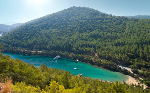 Amazing hilltop view of Paradise bay. A quiet turquoise tourist beach on the Bodrum peninsula. Aegean coast. Turkey holidays and travel. Mugla city, Turkey country