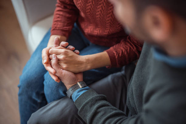 istock A man and a woman hold hands tightly, a strong bond and trust 2192989170