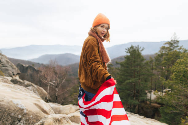 istock Satisfied woman with American flag 2192989233