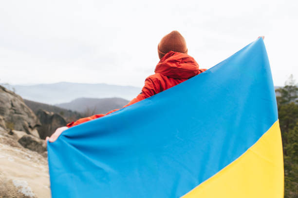 istock Man with Ukrainian Flag Overlooking Scenic Mountain View 2192990289