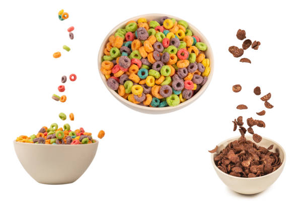 istock Colorful cereal box for morning breakfast. Corn flakes falling to the white bowl. Motion. 2192996685