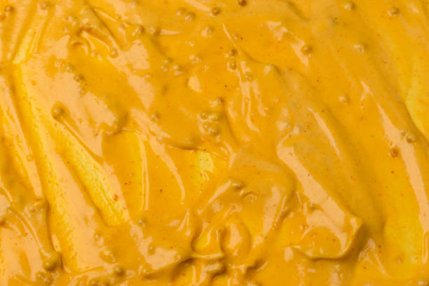 istock Yellow sauce splashes as a background. 2192996699