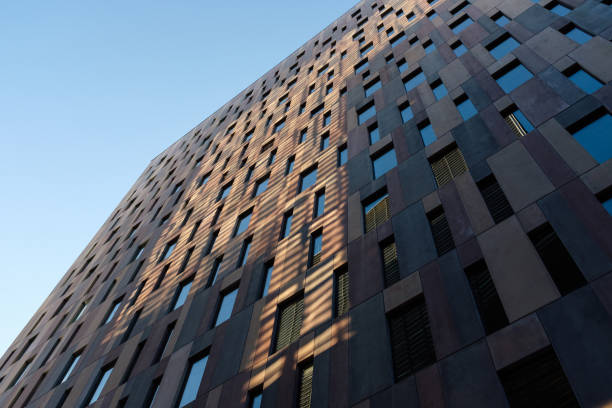 istock Modern building exterior reflecting sunlight and shadows 2192996715