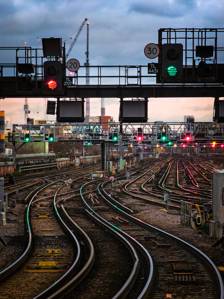 istock Curved railway tracks illuminated at dusk in the city 2192997611
