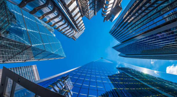 istock Futuristic gleaming glass skyscrapers soaring into blue sky panorama London 2192999725