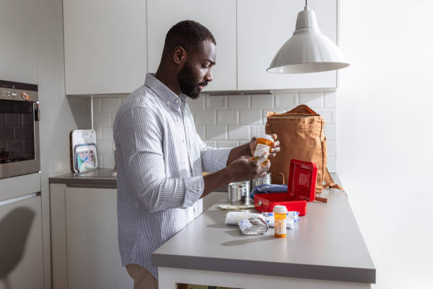istock Man organizing first aid supplies and emergency kit at home 2193000724