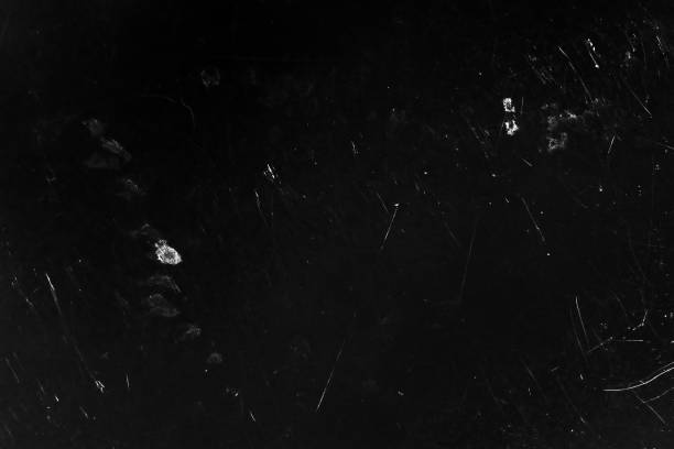 istock Black surface showing scratches and light spots. Grunge texture background 2193004829