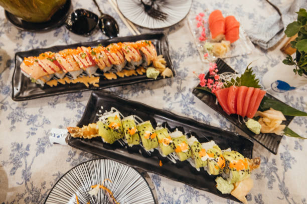 Assorted Sushi Rolls and Sashimi on Elegant Dining Table