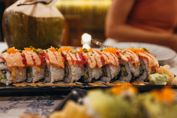 istock Close-up of Fresh Sushi Rolls with Avocado and Fish Roe 2193006461