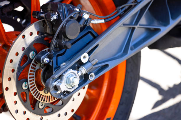 Closeup modern motorcycle wheel, with brake disc background with copy space, full frame horizontal composition