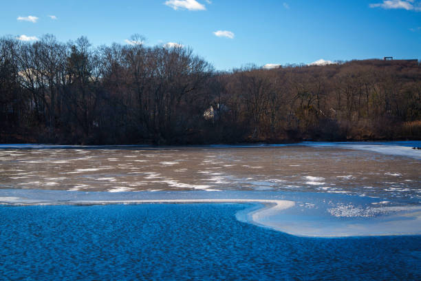 Lake with frozen ice and snow, a New England Winter Landscape at Sleeping Giant Park in Hamden, Connecticut