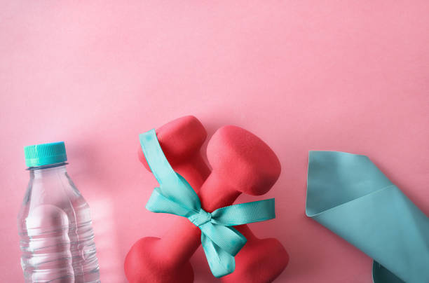 istock Workout session gift concept with pink and cyan sport equipment 2193008384
