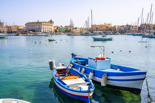 Siracusa, Italy 1 april 2024 - Fishing boats in the harbour waiting to sail out