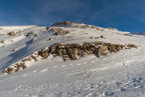 istock Beautiful sunny day in the mountains with snow 2193009012
