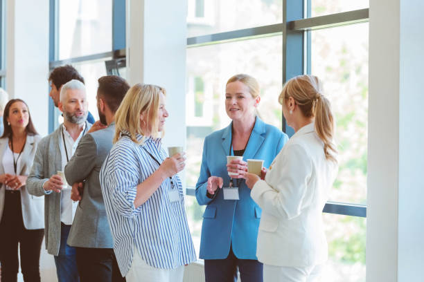 istock Business people in convention center during coffee break 2193011973