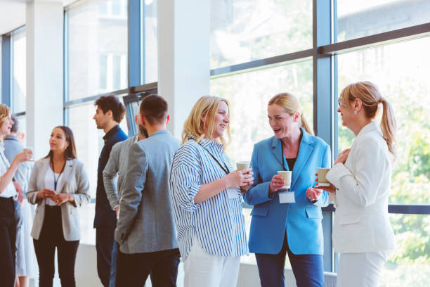 istock Business people in convention center during coffee break 2193012090