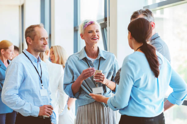 istock Business people in convention center during coffee break 2193012263