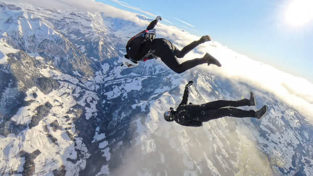 istock Freefall jumpers face each other mid-air 2193013788