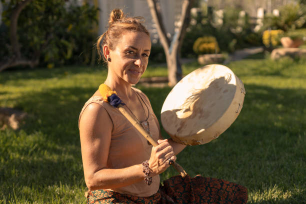istock young woman playing shamanic drum 2193016086