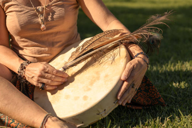 istock young woman playing shamanic drum 2193016092