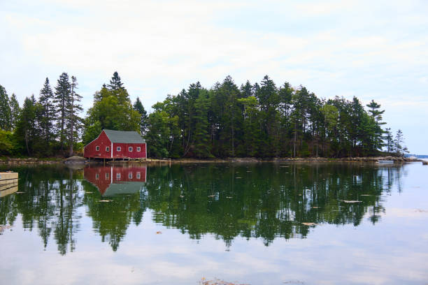 istock Cottage on the water 2193016334