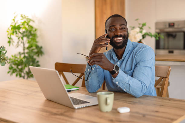 istock Happy freelancer talking on the phone and working from home 2193017330