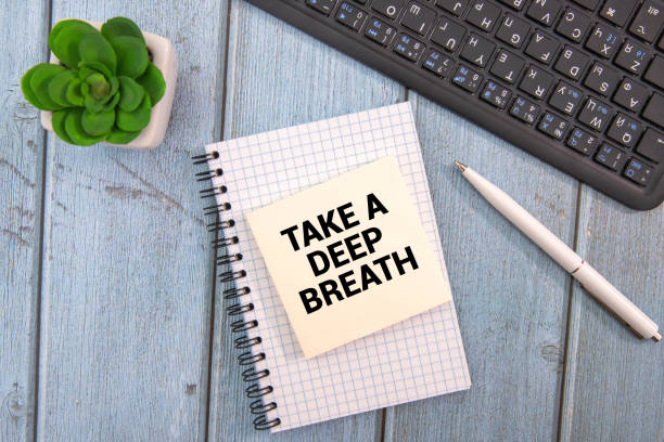 istock Words of Take Deep Breath on sticky color papers hanging 2193020842