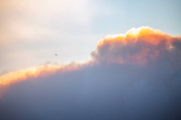 Airplane amphibia firefighter drops water in the sky