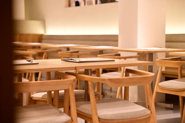 istock Cozy Dining: Natural Wood and Warm Lighting 2193023591