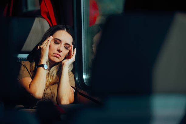 istock Woman Suffering a Headache Traveling by Train 2193028684