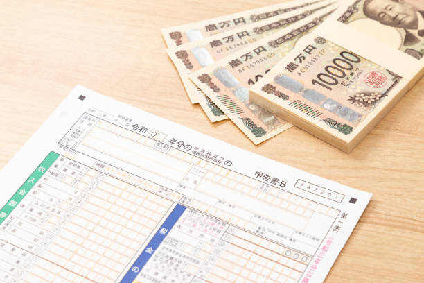 istock Tax return documents and a calculator on a desk. 2193028954
