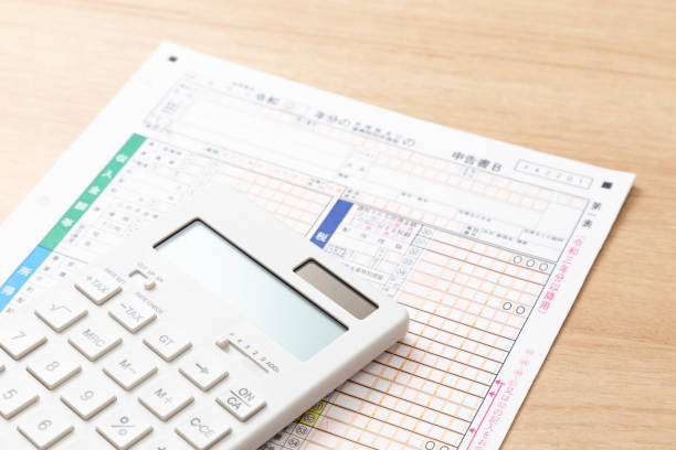 istock Tax return documents and a calculator on a desk. 2193028965