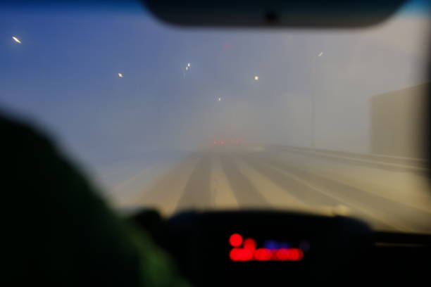 Mountain road in fog in the evening