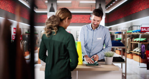 istock Cashier Retail Assistant At Cloth Store 2193033284