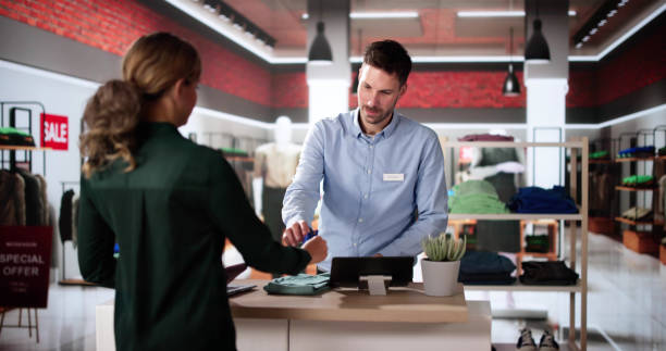 istock Cashier Retail Assistant At Cloth Store 2193033287