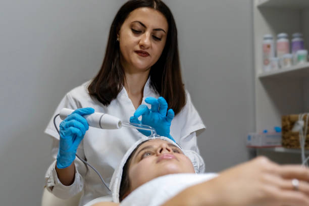 istock Woman at the spa getting a rejuvenation treatment on her face 2193036206