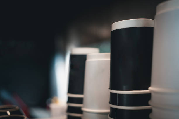 istock Black and white coffee glasses are standing atop the coffee machine. 2193036736
