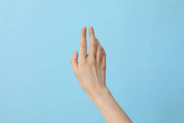 istock Female well-groomed hand on a light blue background 2193039013