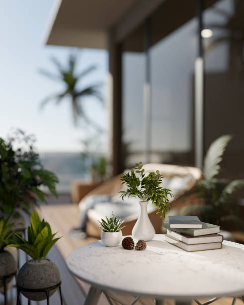istock A close-up of a round table with decorative objects on a balcony with a stunning beach view. 2193039017