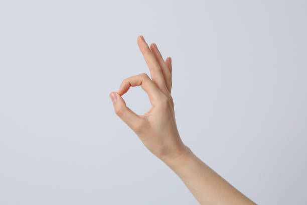 istock Female hand shows OK gesture. OK hand sign 2193039537