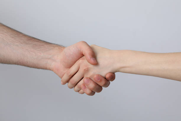 istock A female and a male hand make a handshake 2193039575