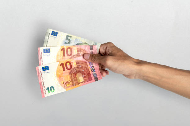 istock Human hand holding euro banknote cash on white background 2193043066