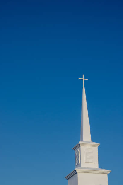istock Church Steeple Against a Clear Blue Sky 2193044352