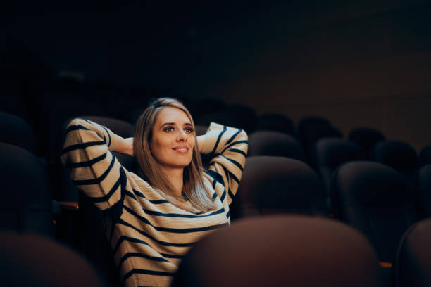 istock Happy Relaxed Woman Sitting in a Private Screening Room 2193044782