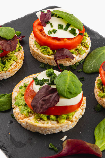 istock Healthy eating concept, rice cakes with avocado, mozzarella, spinach and onion 2193046041
